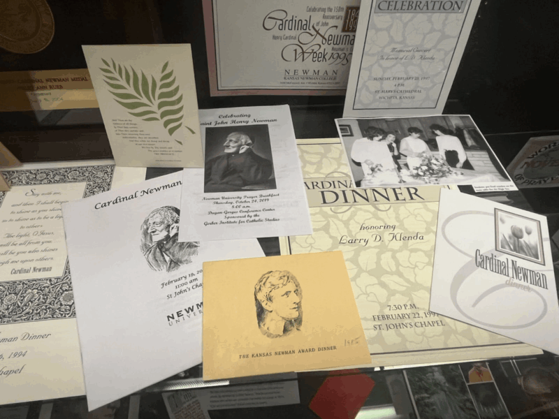 Shows St. Newman-themed event pamphlets 