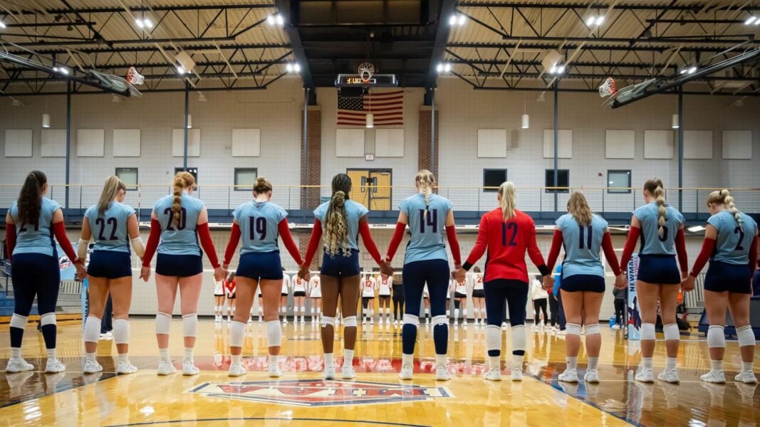 Women's Volleyball in prayer (Courtesy photo: Richard Rico)