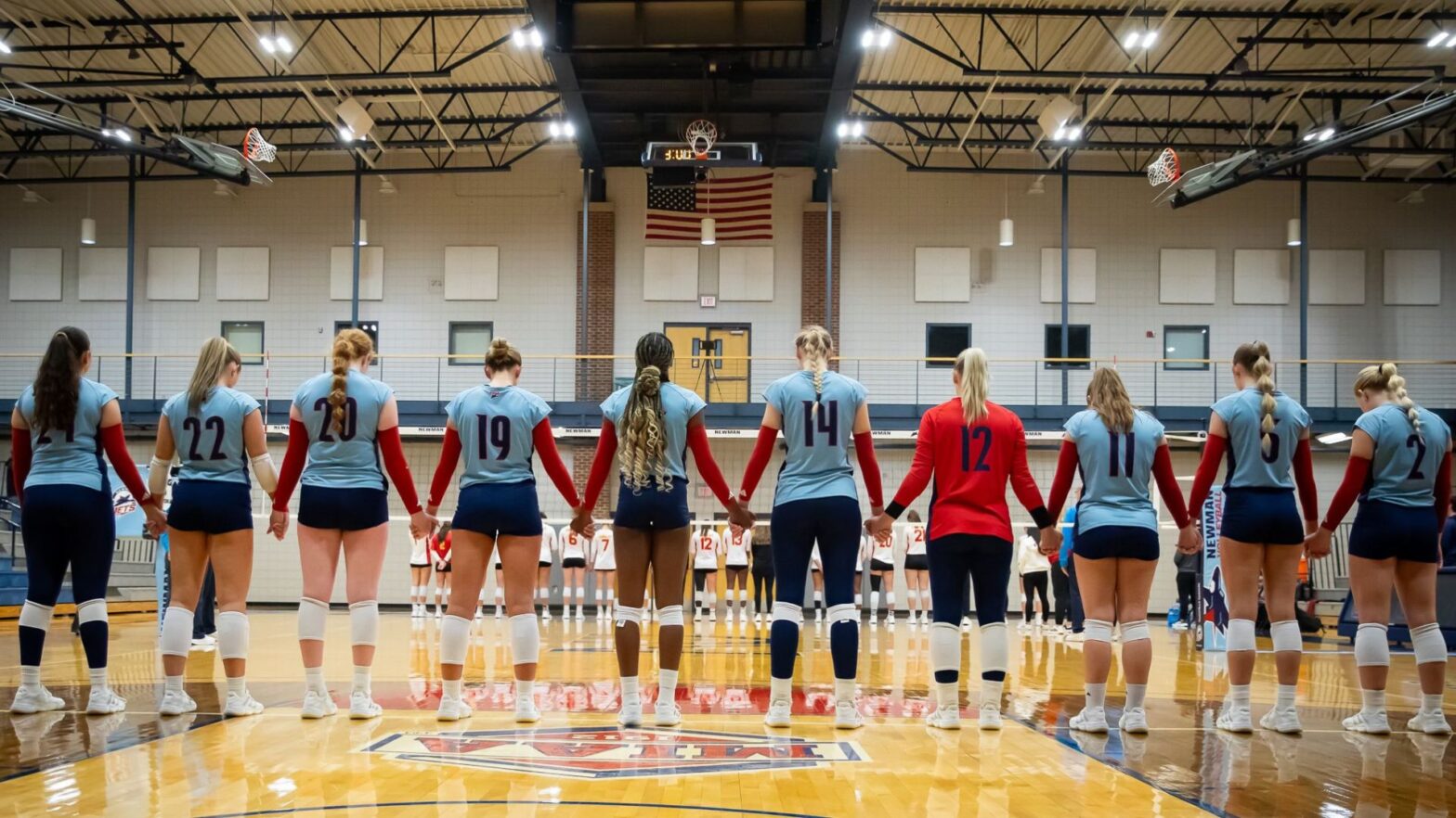 Women's Volleyball in prayer (Courtesy photo: Richard Rico)