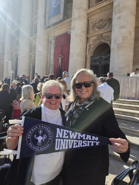 Following Mass, Jagger poses with a Newman University pennant with Hughes, the ASC superior general.