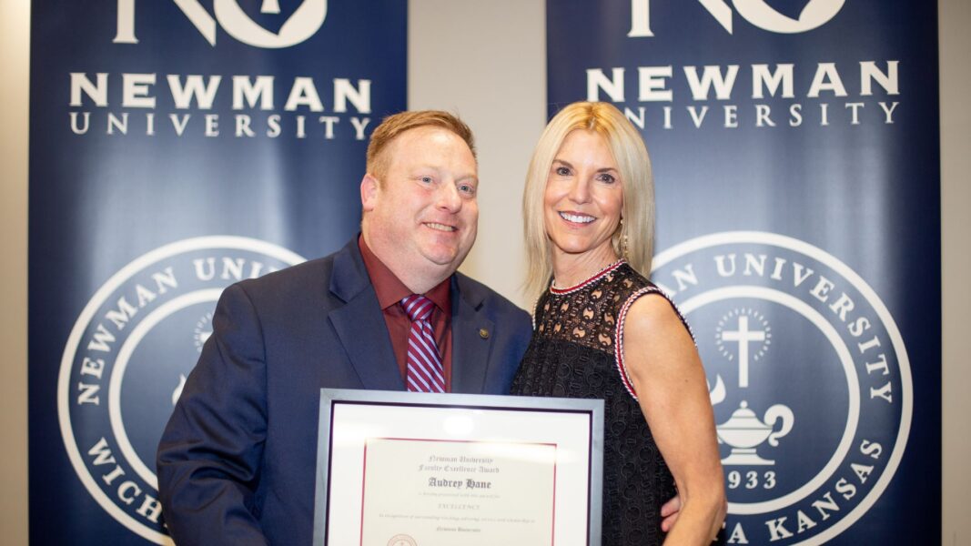 Stout awards Hane with a 2025 Faculty Excellence Award.