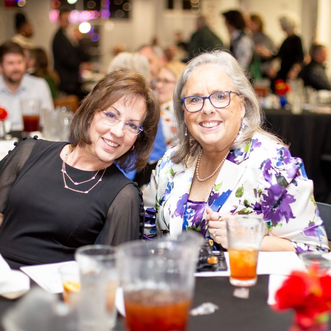 (From left to right) Newman Board of Trustees Chair Jenifer Stone, APRN, '87, '93, with Jagger at the Faculty Awards Banquet
