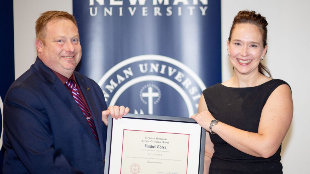 Vice President of Academic Affairs Alden Stout awards Cheek.