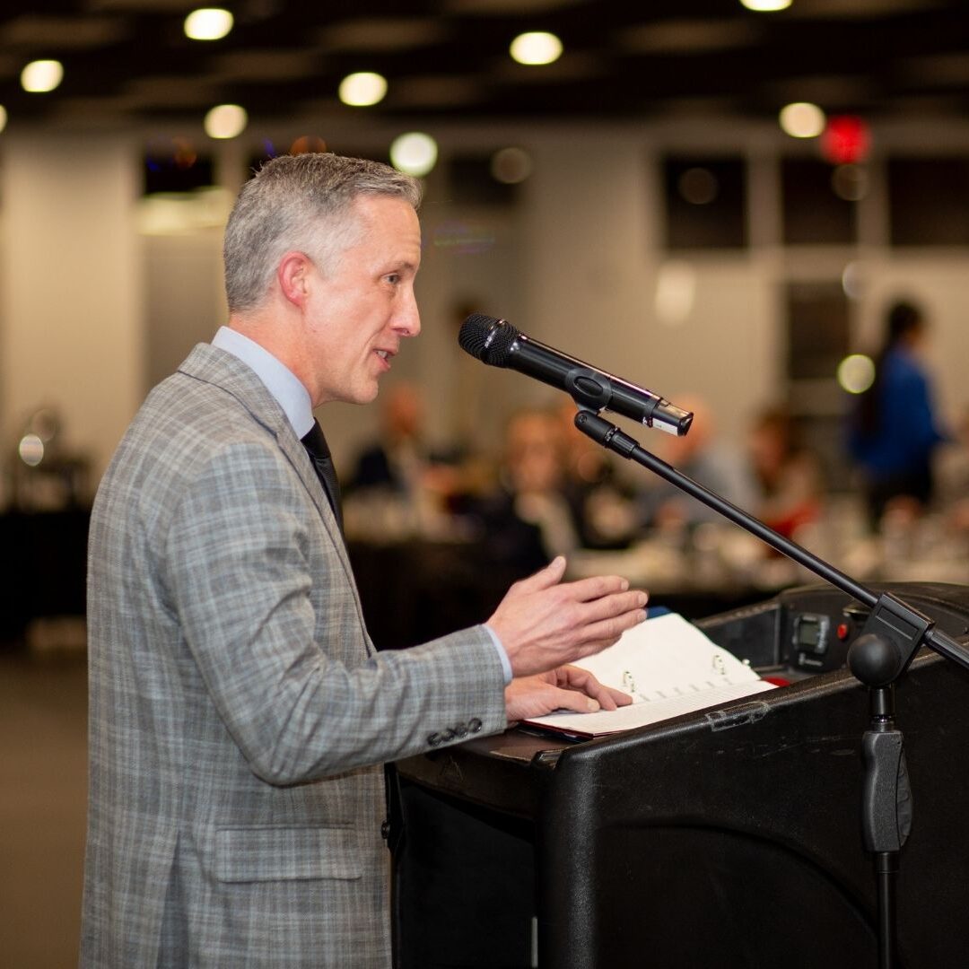 Stoltzfus addresses the Newman faculty in attendance with a keynote speech.