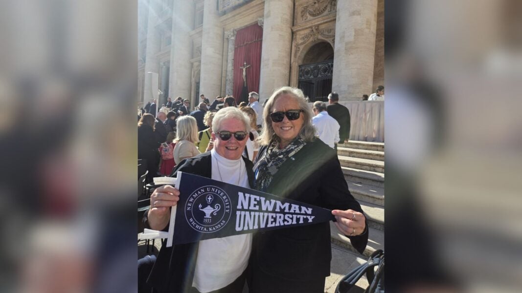 Following Mass, Jagger poses with a Newman University pennant with Hughes, the ASC superior general.