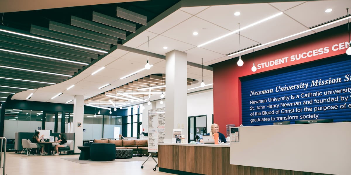 Image of the Student Success Center desk and seating in library
