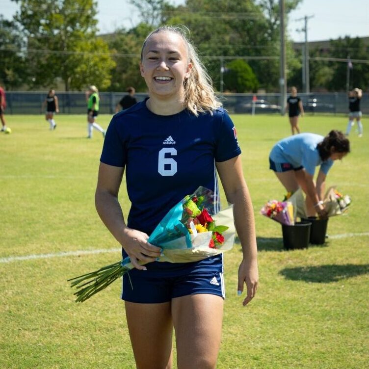 Johnson celebrates senior day with flowers (Courtesy photo: Richard Rico)