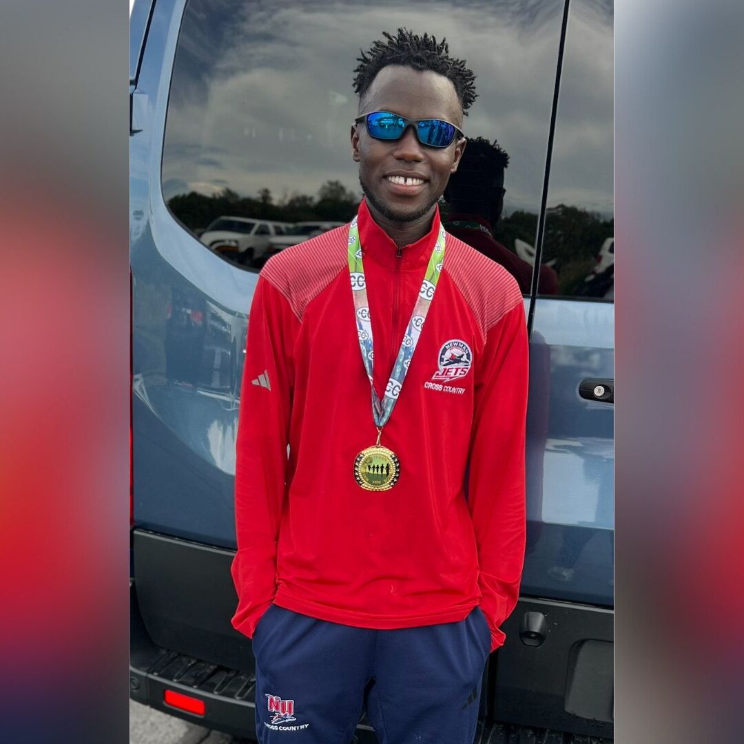 Kiprotich with his gold medal after his individual win