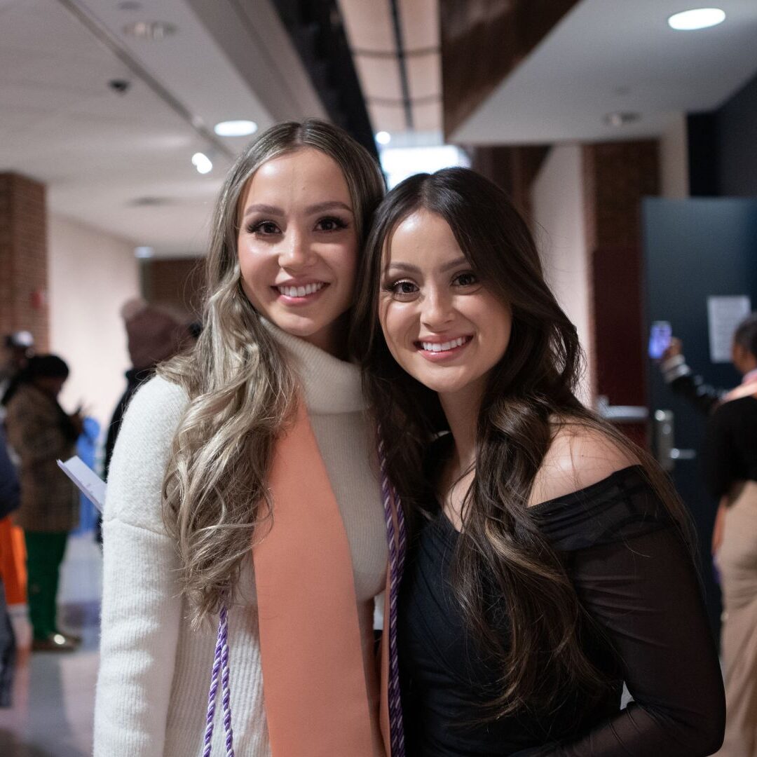 (From left to right) Metzger with sister Emily, a 2022 Newman graduate