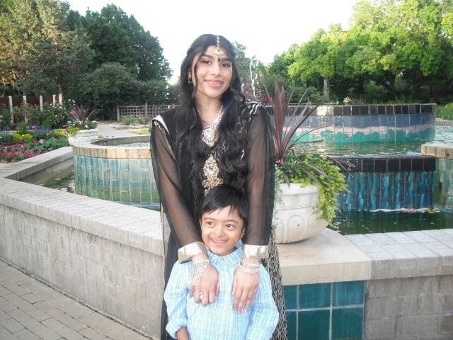 Pictures Ahmed posing with her brother with Down syndrome