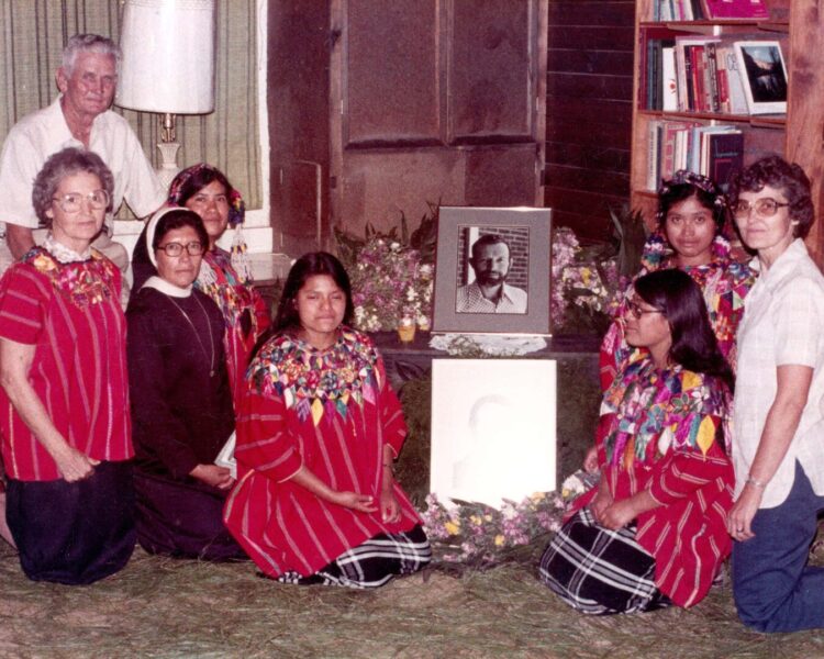 Pictures Rother family, including Sister Marita, in front of Father Rother picture
