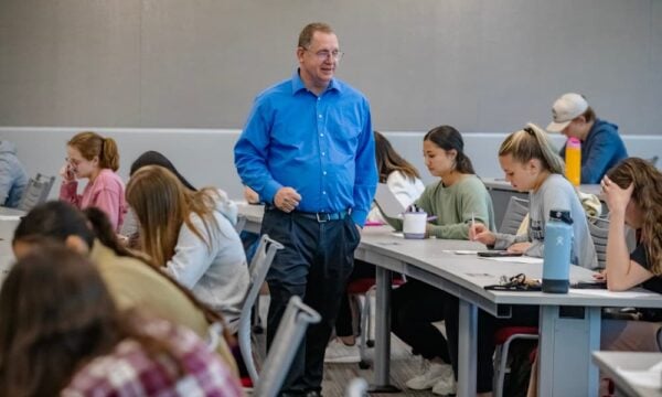 Newman University Associate Professor Alan Oberley in Bishop Gerber classroom with students.