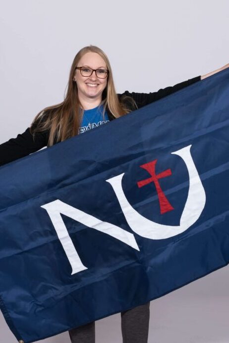 Drewes posing with Newman Flag