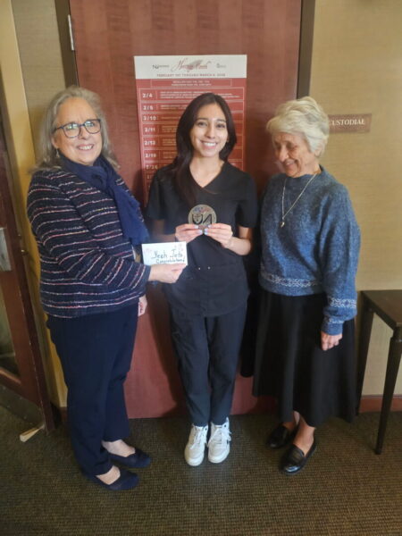 Pictures Nunez-Palomares holding medallion with ASC sister and university president