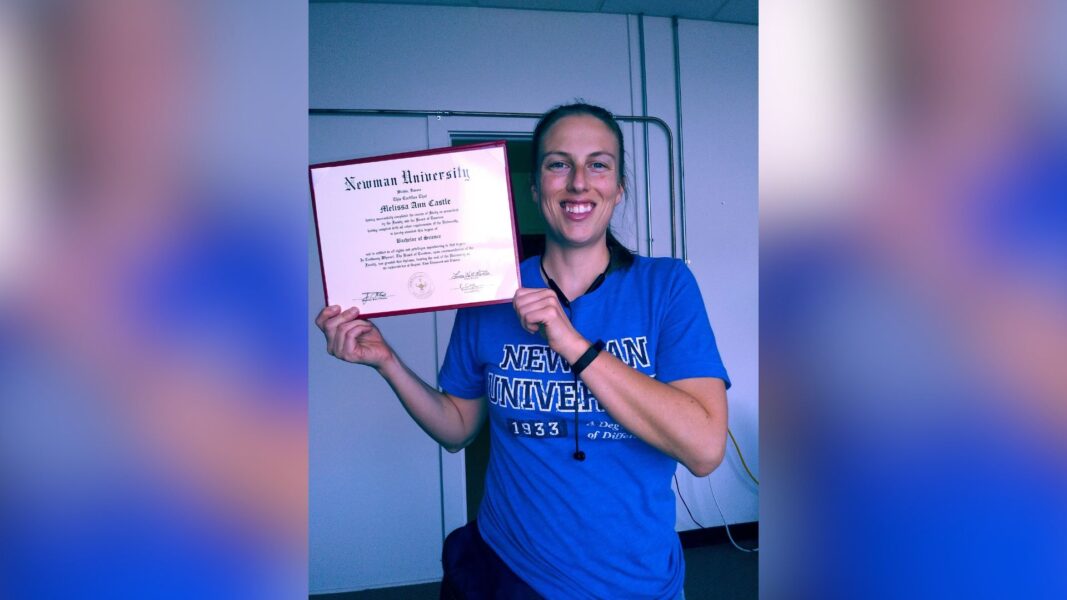 Castle posing with her Newman degree