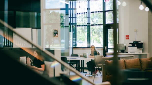 A student studies at a table in the Student Success Center.