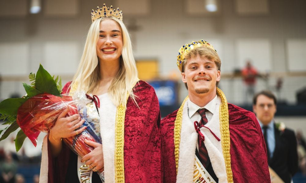 Lioukina and Schreiner don their royal cloaks and crowns after being named the 2026 homecoming queen and king.