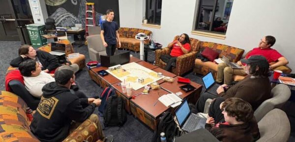 A group of students gathers in the Student Activities Center in Dugan to play Dungeons and Dragons. (Photo courtesy of Anna Corbett-Neal)