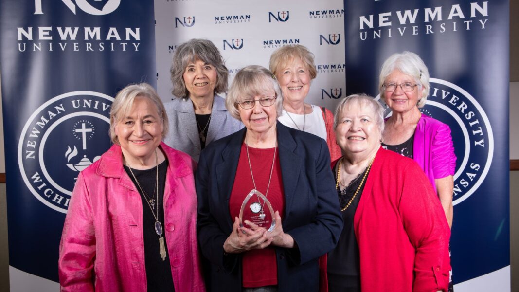 Rowley (center) with fellow graduates of Sacred Heart Academy