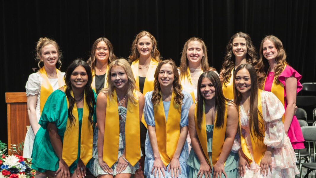 Smith (back row, second from the left) smiles with fellow 2025 graduates of Newman's diagnostic sonography program.