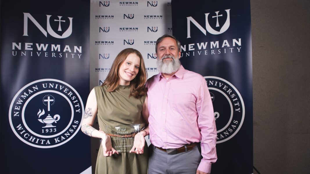 Breaux, recipient of the Excellence in Master of Social Work Award, with her family member