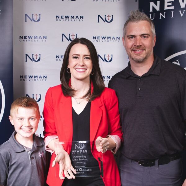 Gerlach, recipient of the Outstanding Doctor of Business Administration Award, with her family