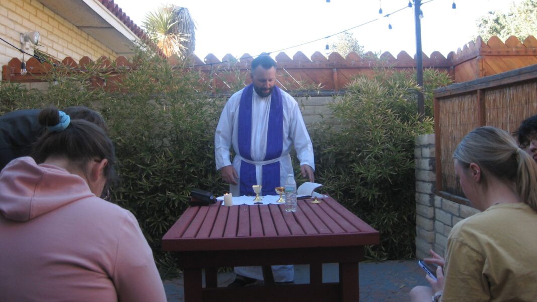 Herzog offers Mass outdoors at the Airbnb.