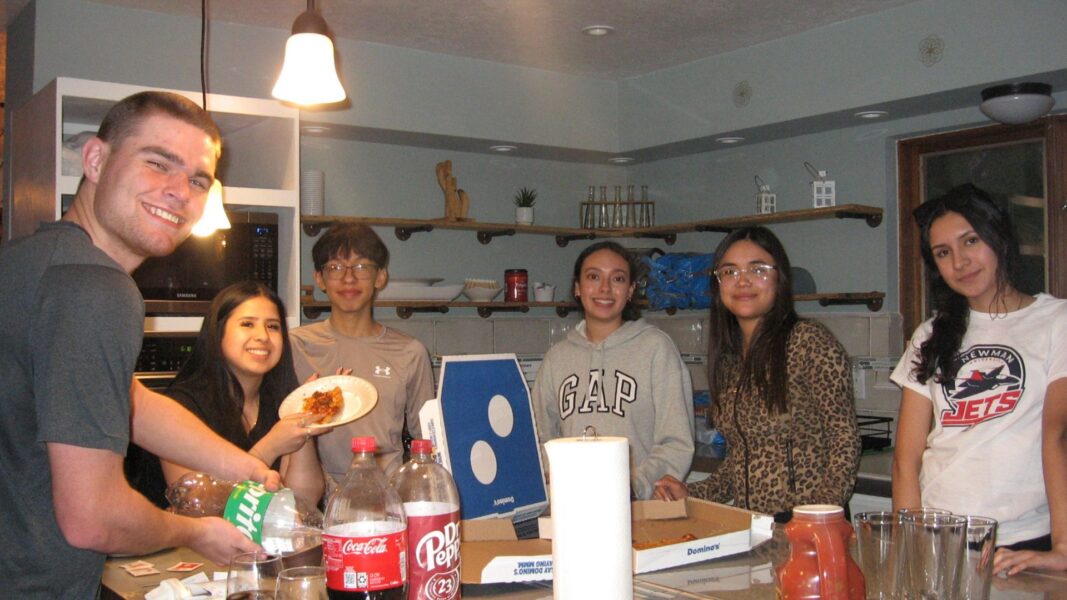 Students enjoy a "build-your-own pizza" night at the Airbnb in Albuquerque, New Mexico.