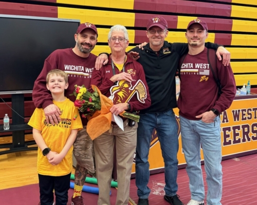 LeFever (center) with coaches and one of their sons at Wichita West High