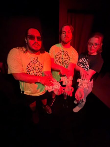 (From left to right) Trevino, Maxwell Masem and Dannicka McGrath show off their $2 winnings.