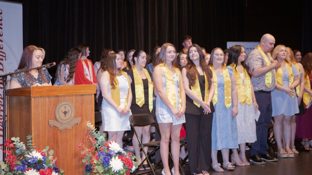 All School of Healthcare Professions graduates rise to be recognized.
