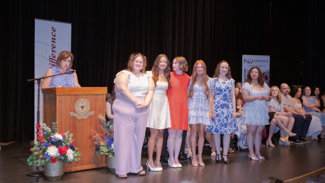 (From left to right) Lugo-Baez recognizes nursing graduates Coppola, Yates, Waters, Sparks, Keck and Martinez.