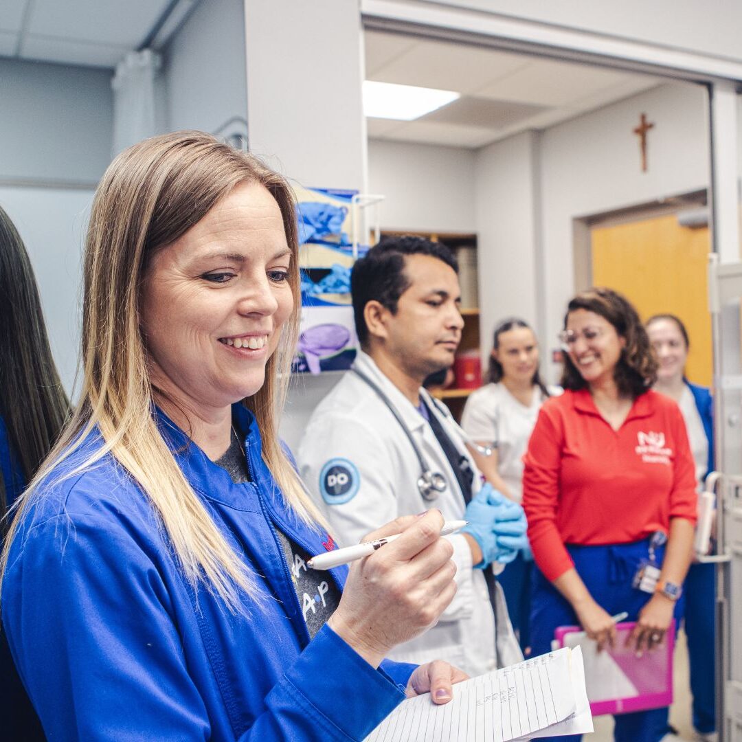 Fox (left) took notes as students performed various roles during the simulation.