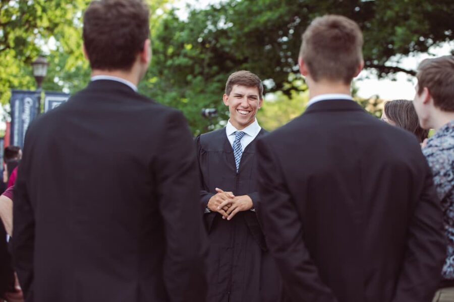 Munn mingles with fellow graduates following the Baccalaureate Mass on May 15.