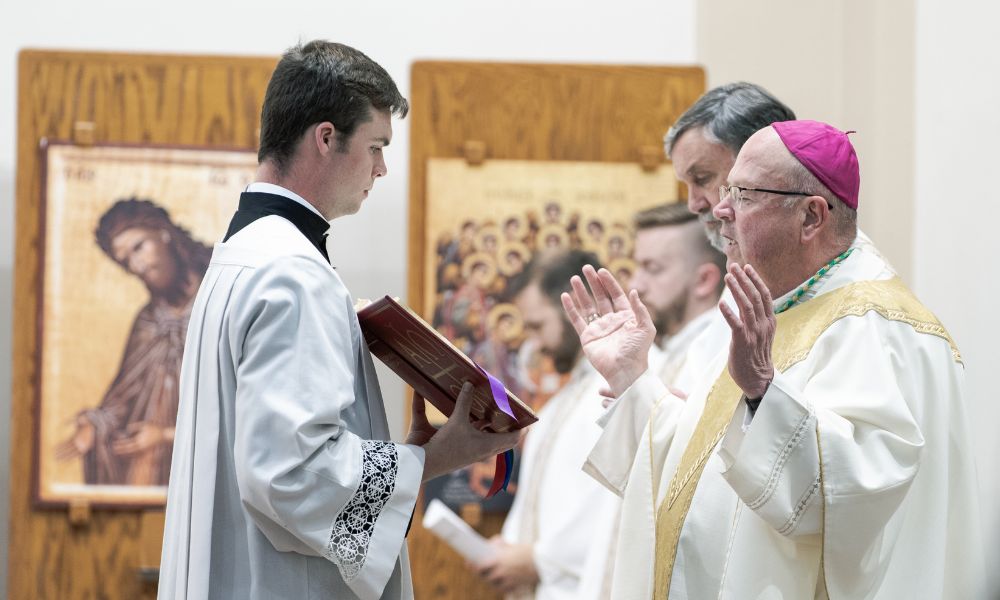 Bishop Carl Kemme praying during the 2026 Baccalaureate Mass.