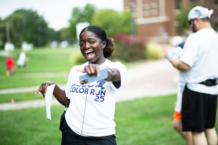 Smith dons a "Color Run '25" while hosting the event as chair of CAB.
