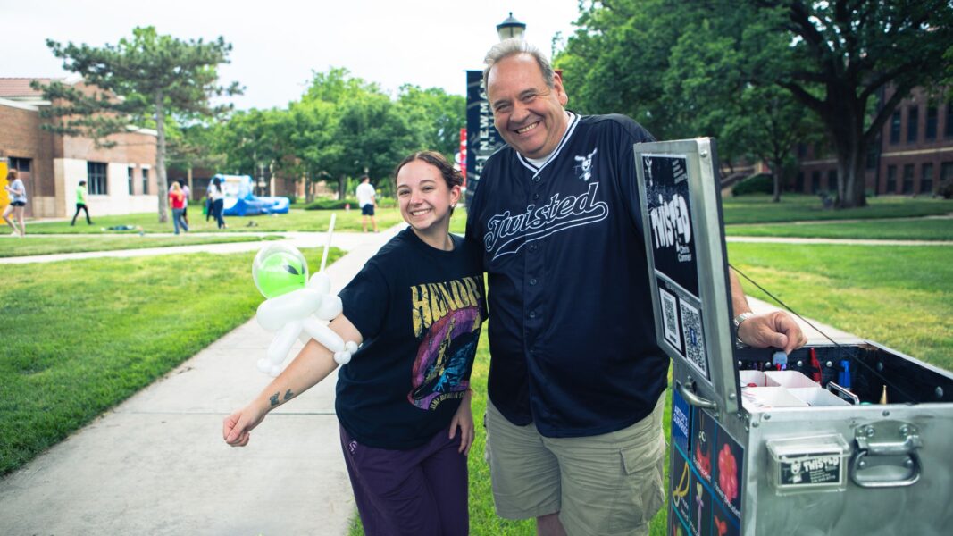 A student shows off her alien balloon at Spring Fling.