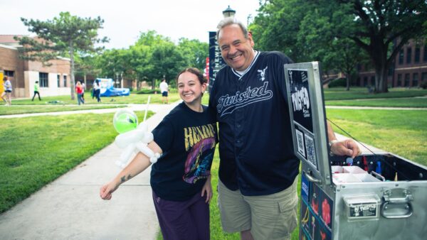 A student shows off her alien balloon at Spring Fling.