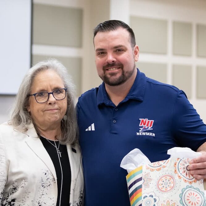 Nance is congratulated with a gift from Jagger.