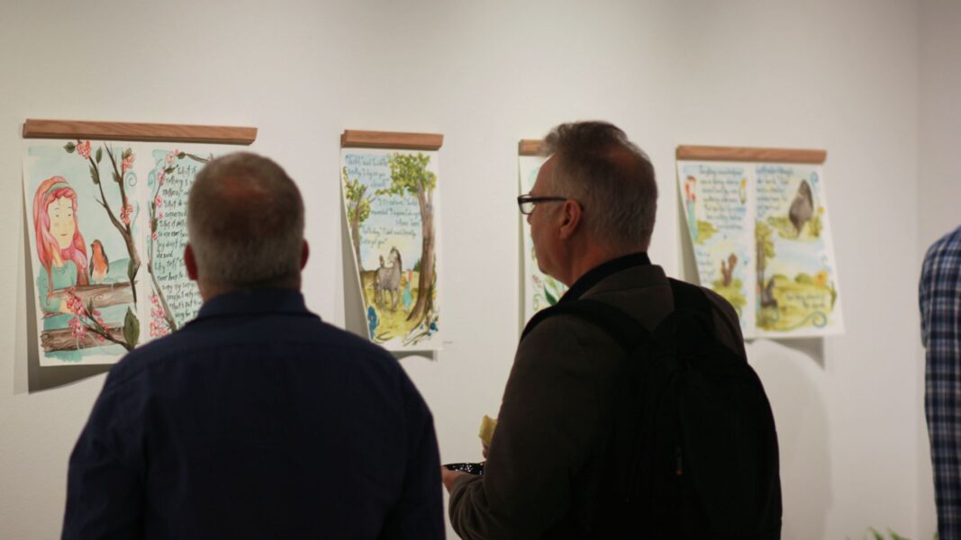 The music from a harpist and guests filled the Steckline Gallery during Strickbine's exhibition.