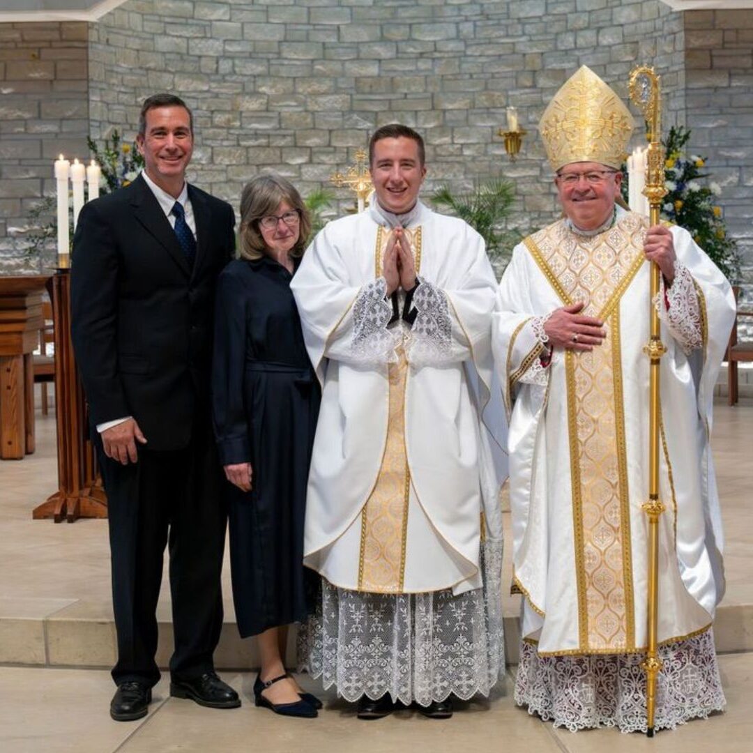 Meyerhoff with his parents and Bishop Kemme (Courtesy photo: Catholic Advance)