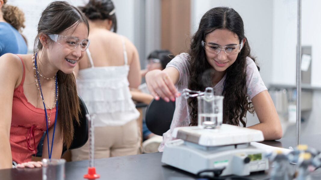 Students conduct experiments in one of the Newman University labs.