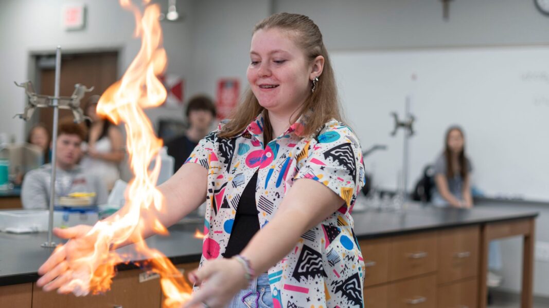 Loeppke plays with fire during ISSP week at Newman University.