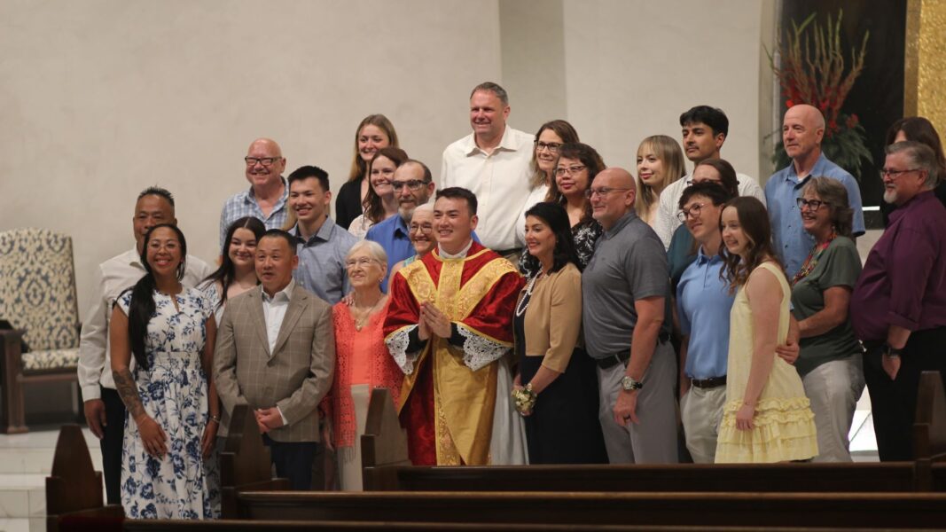 Nguyen with his family after celebrating his first Mass as a priest.