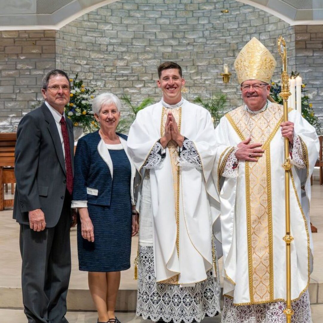 Bergkamp with his parents and Bishop Kemme