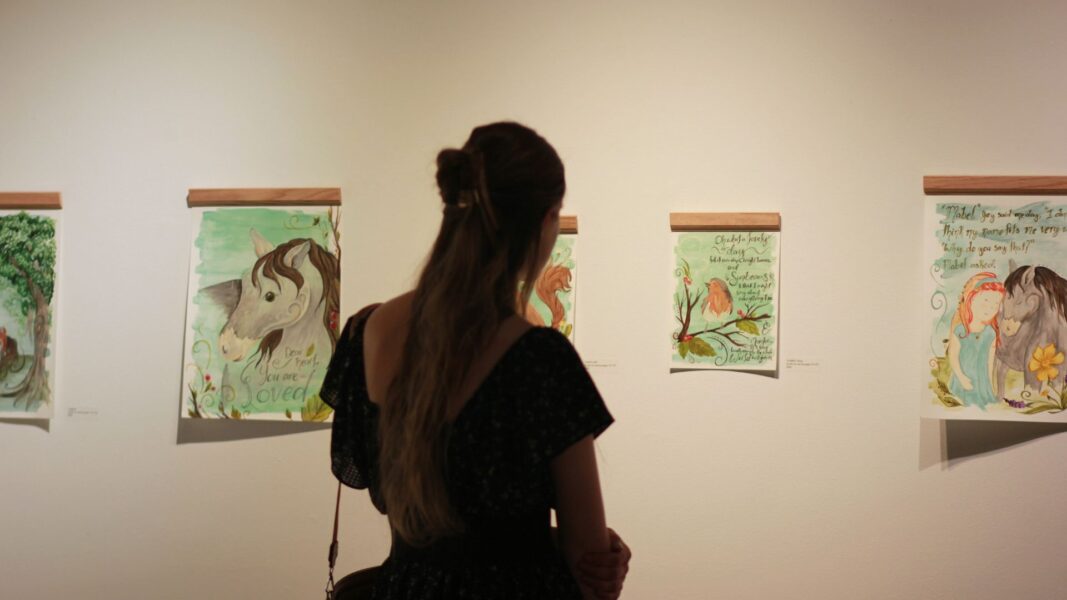 The music from a harpist and guests filled the Steckline Gallery during Strickbine's exhibition.