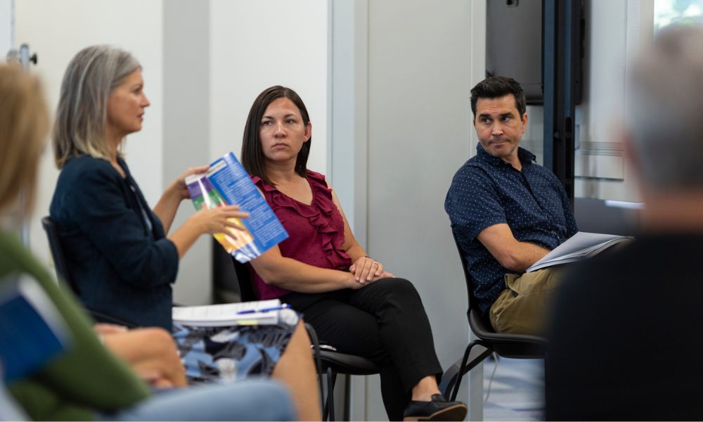 Newman faculty having a discussion in Center for Teaching and Learning