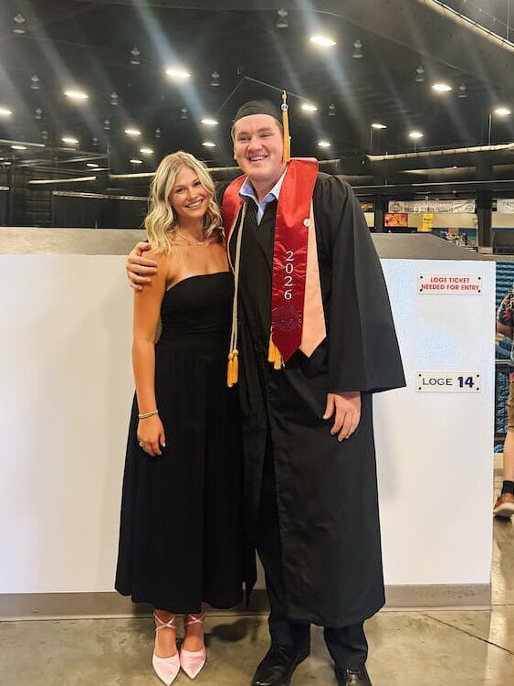 Lane and Simons following Newman University's commencement ceremony