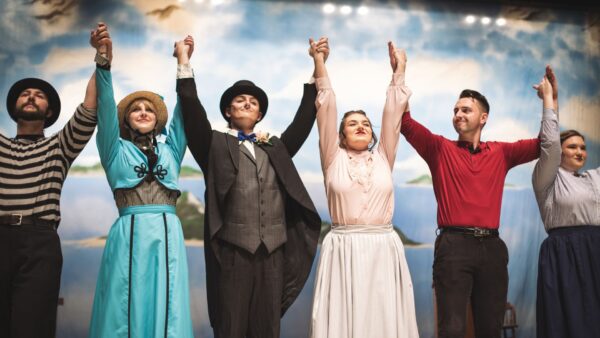 Actors and actresses of Newman University's "Carousel" production take a bow.