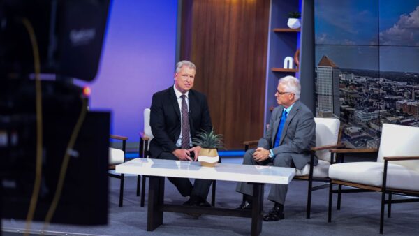 Straub (right) was featured in a KAKE News segment about data centers on July 3, marking his 200th news interview.